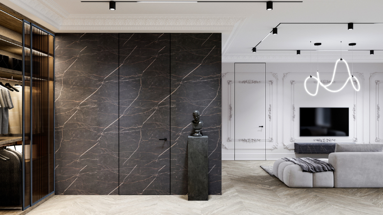 Контрастный интерьер с тёмной гардеробной, светлой гостиной и светлой дверью.